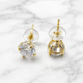 10K yellow gold 6mm round CZ stud earrings showing side and back view with push-back posts on marble surface