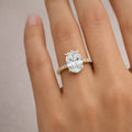 14k yellow gold oval diamond engagement ring with pavé band worn on woman's hand luxury jewelry gift