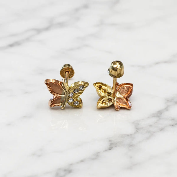 14K tri-color gold CZ butterfly stud earrings front and back view on marble surface with screw backs