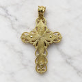 Back of the 14K two-tone gold filigree crucifix pendant showing engraved panels, scrollwork, and corpus mounting pins