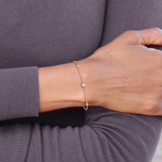 14K yellow gold lab grown diamond cable bracelet worn on wrist showing delicate everyday fit