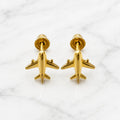 14K yellow gold airplane screw back stud earrings with polished airplane design on marble surface
