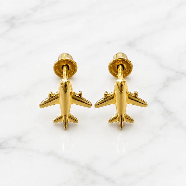 14K yellow gold airplane screw back stud earrings with polished airplane design on marble surface