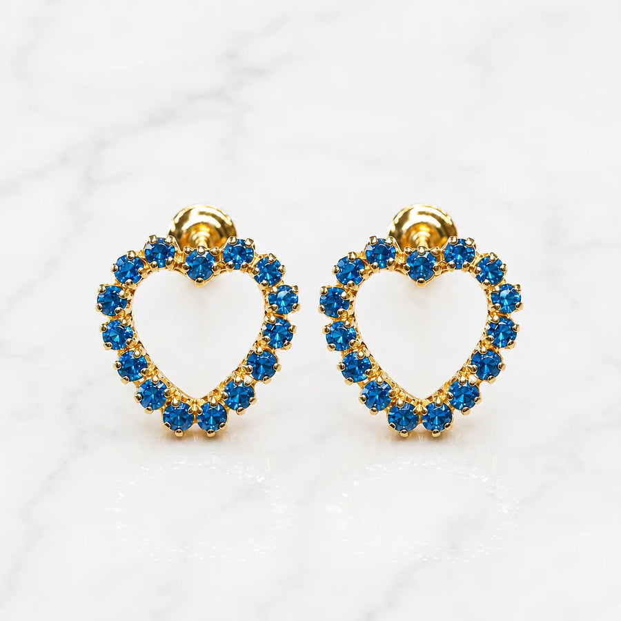 14K yellow gold blue CZ heart screw back stud earrings with open heart design on marble surface