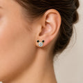 14K yellow gold clear and black CZ mouse ear stud earring worn on ear showing scale and fit