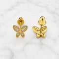 14K yellow gold CZ butterfly screw back stud earrings front and back view on marble surface