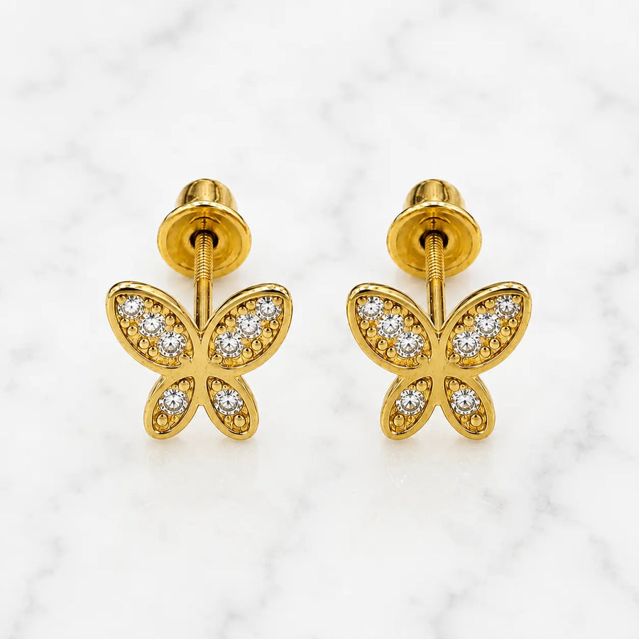 14K yellow gold CZ butterfly screw back stud earrings with clear stones and beaded wing details on marble surface