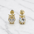 14K yellow gold CZ owl screw back stud earrings front and back view with heart-shaped stones on marble surface