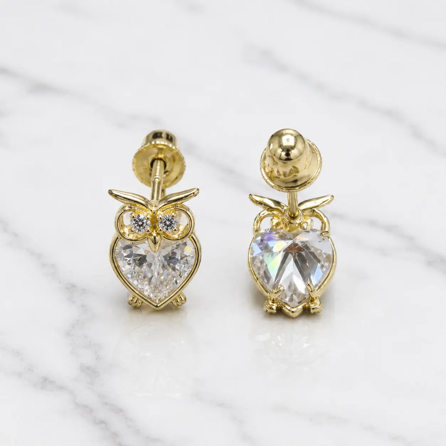 14K yellow gold CZ owl screw back stud earrings front and back view with heart-shaped stones on marble surface