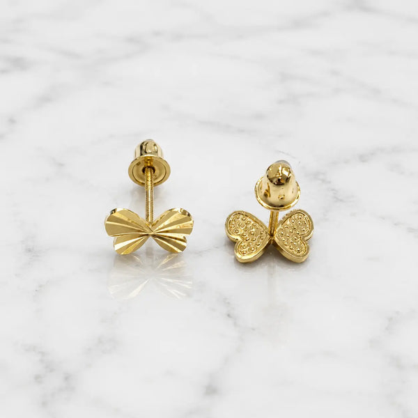 14K yellow gold diamond-cut bow stud earrings front and back view on marble surface with screw backs