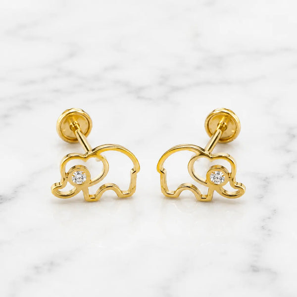 14K yellow gold elephant screw back stud earrings with open outline and clear CZ center on marble surface