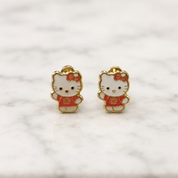 14K yellow gold enamel cat screw back stud earrings with white and red enamel details on marble surface