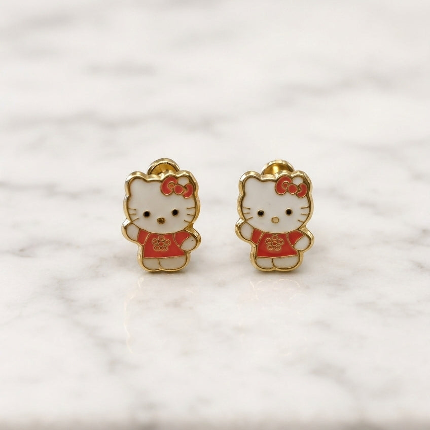 14K yellow gold enamel cat screw back stud earrings with white and red enamel details on marble surface