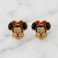 14K yellow gold enamel mouse face stud earrings with black ears and red bow detail on marble surface