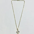 14K yellow gold four-leaf clover necklace full length flat lay showing 16 inch cable chain and spring ring clasp