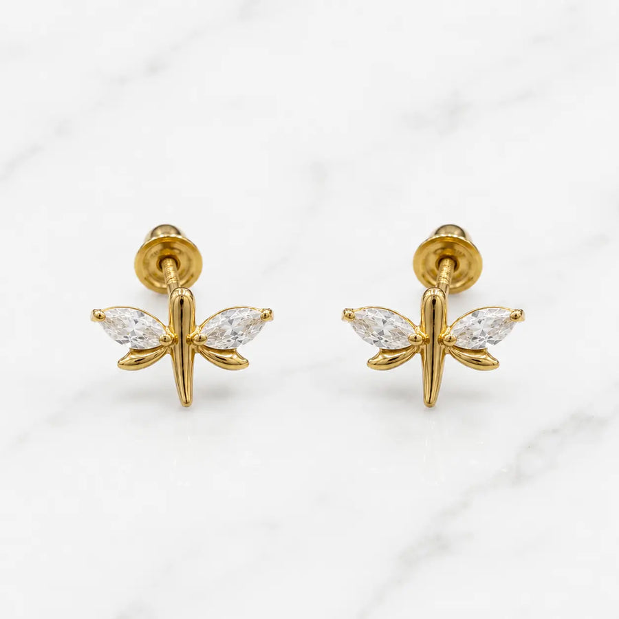 14K yellow gold dragonfly screw back stud earrings with marquise CZ wings on marble surface