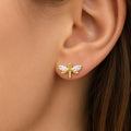 14K yellow gold CZ dragonfly stud earring worn on ear with marquise wings showing scale and fit