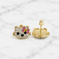 Medium 14K yellow gold cat stud earrings with clear, pink, yellow, and black CZ stones on marble surface