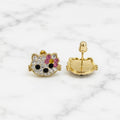 Small 14K yellow gold cat stud earrings with clear, pink, yellow, and black CZ stones on marble surface
