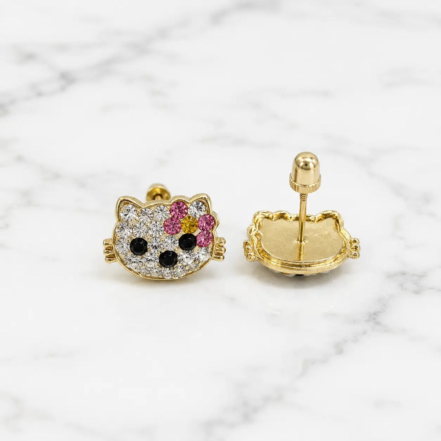 Small 14K yellow gold cat stud earrings with clear, pink, yellow, and black CZ stones on marble surface