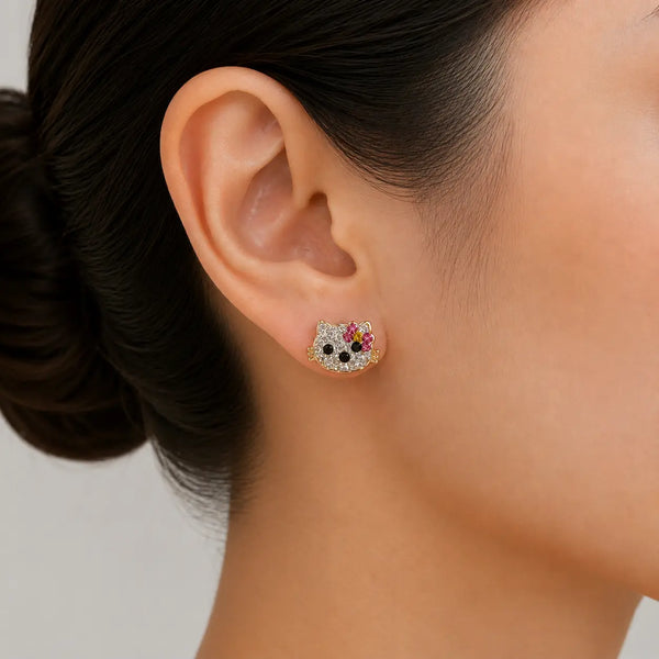 14K yellow gold multi-color CZ cat stud earring worn on ear showing scale and fit