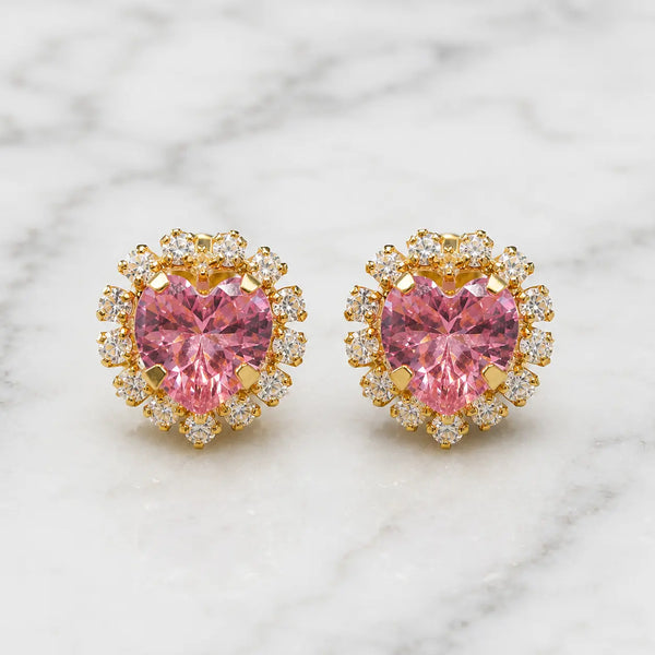 14K yellow gold pink CZ heart halo stud earrings with clear CZ accent stones on marble surface