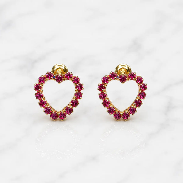 14K yellow gold pink CZ heart screw back stud earrings with open heart design on marble surface