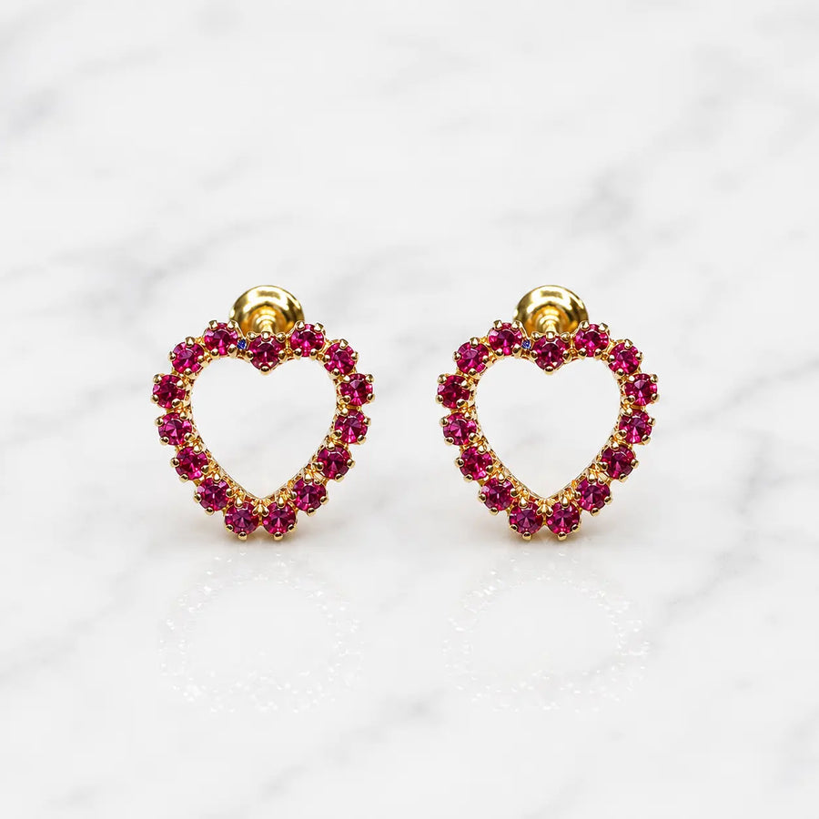 14K yellow gold pink CZ heart screw back stud earrings with open heart design on marble surface
