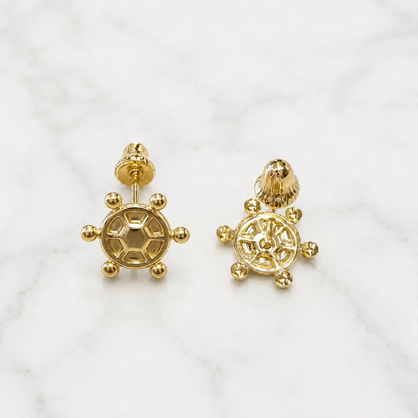 14K yellow gold ship wheel screw back stud earrings front and back view on marble surface