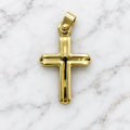 14K yellow gold polished grooved cross pendant with budded tips and ball-accent bail on white marble surface