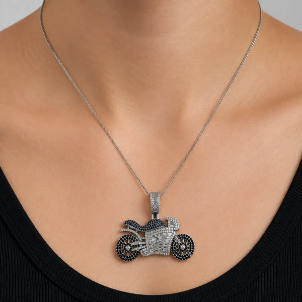 Sterling silver black and clear CZ motorcycle pendant worn on a thin chain showing its statement-size design