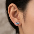 Sterling silver blue alien enamel stud earring worn on ear showing petite colorful style
