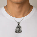 Sterling silver eagle head pendant with blue CZ eye worn on a thin chain showing size and fit