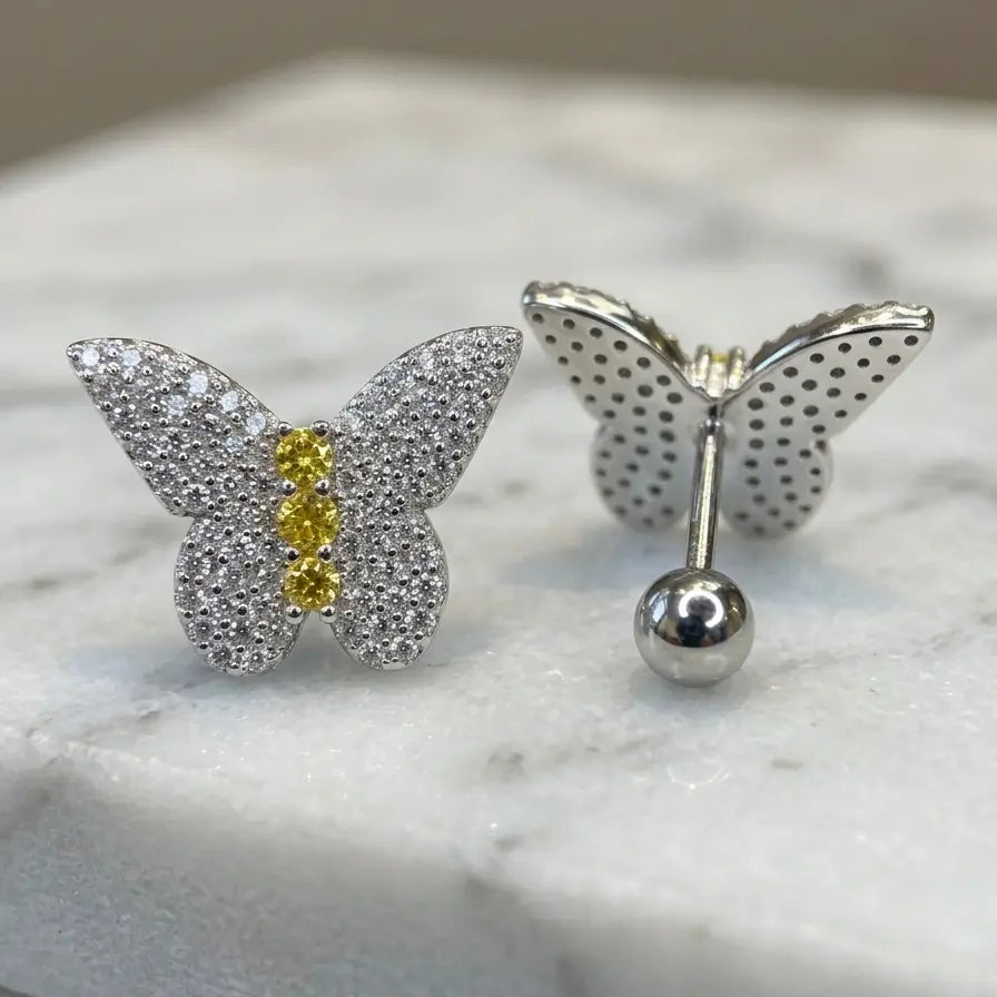 Sterling silver butterfly pavé CZ stud earrings front and back view on marble showing screw-back closure and yellow CZ body stones