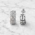 Sterling silver CZ lattice hoop earrings with push-back post and open back detail on marble surface
