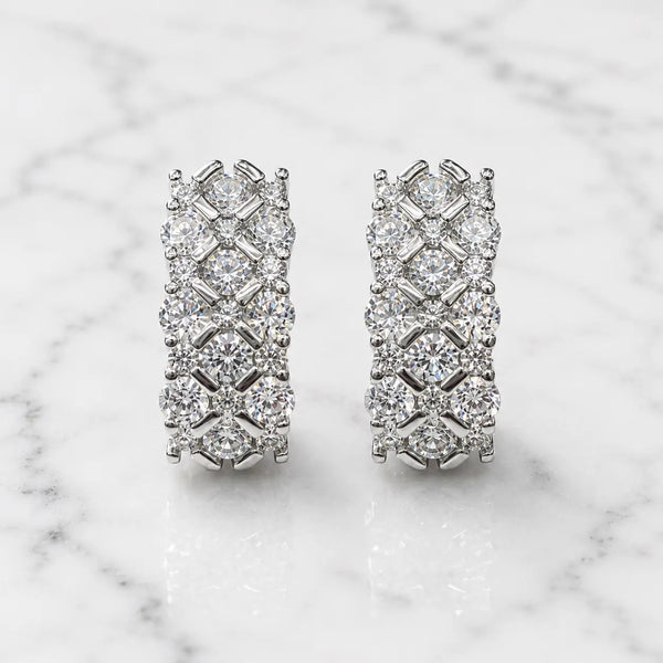 Sterling silver CZ lattice hoop earrings front pair with clear round stones on marble surface