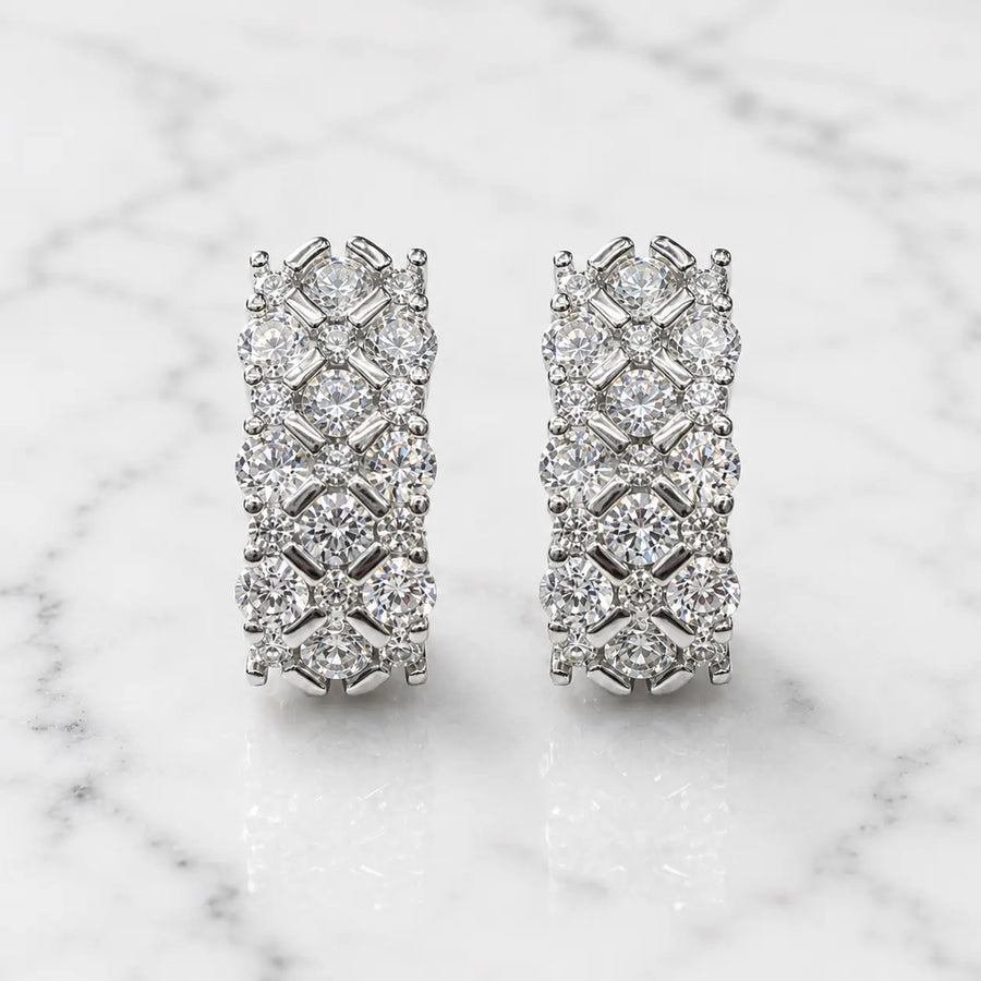 Sterling silver CZ lattice hoop earrings front pair with clear round stones on marble surface