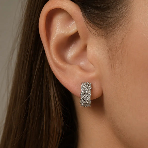 Sterling silver CZ lattice hoop earring worn on ear showing wide 16.3mm size and sparkle