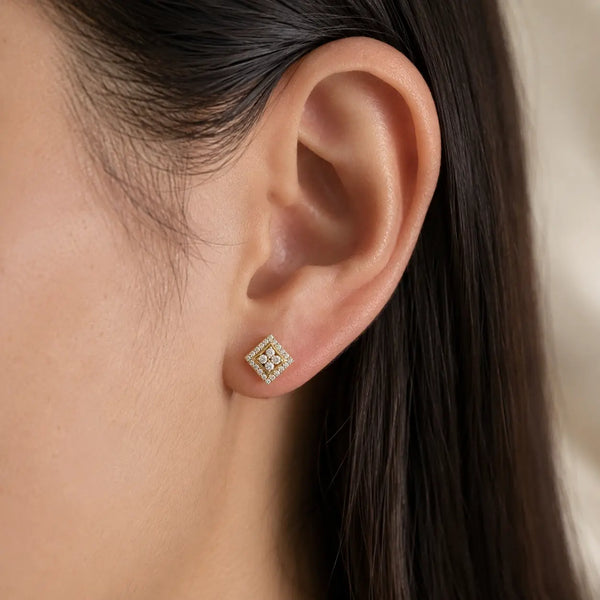 Sterling silver gold-tone moissanite square halo screw-back stud earring worn on ear showing size and fit