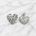 Sterling silver large diamond-cut heart stud earrings front and back view on marble surface