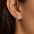 Sterling silver marquise CZ floral stud earring worn on ear showing 17.5mm drop design