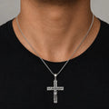 Sterling silver ornate crucifix cross pendant worn at the neckline showing its 56.6mm statement size