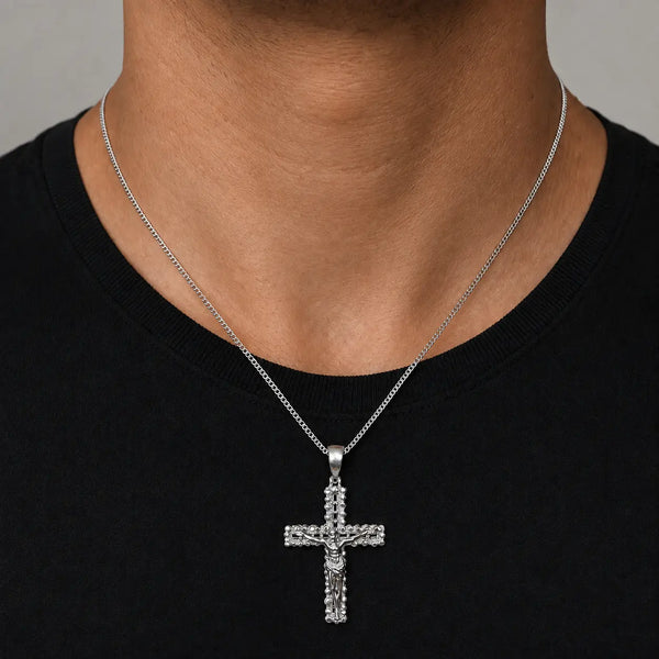 Sterling silver ornate crucifix cross pendant worn at the neckline showing its 56.6mm statement size