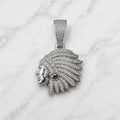 Sterling silver chief head pendant with clear pavé CZ feathers and black CZ accent on marble surface