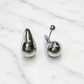 Sterling silver polished teardrop stud earrings with screw-back post detail on marble surface