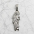 Sterling silver Saint Jude pendant with pavé CZ halo, robe, and bail on marble surface