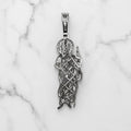 Sterling silver Saint Jude pendant back view showing openwork design and polished bail on marble surface