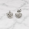 Sterling silver small diamond-cut heart stud earrings front and back view on marble surface