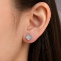 Sterling silver white clover stud earring worn on ear showing scale and fit